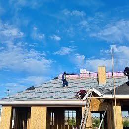 Roofing professional at work